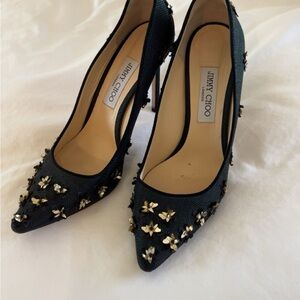 Jimmy Choo Black Pointed-Toe Pumps with Gold Floral Studs
